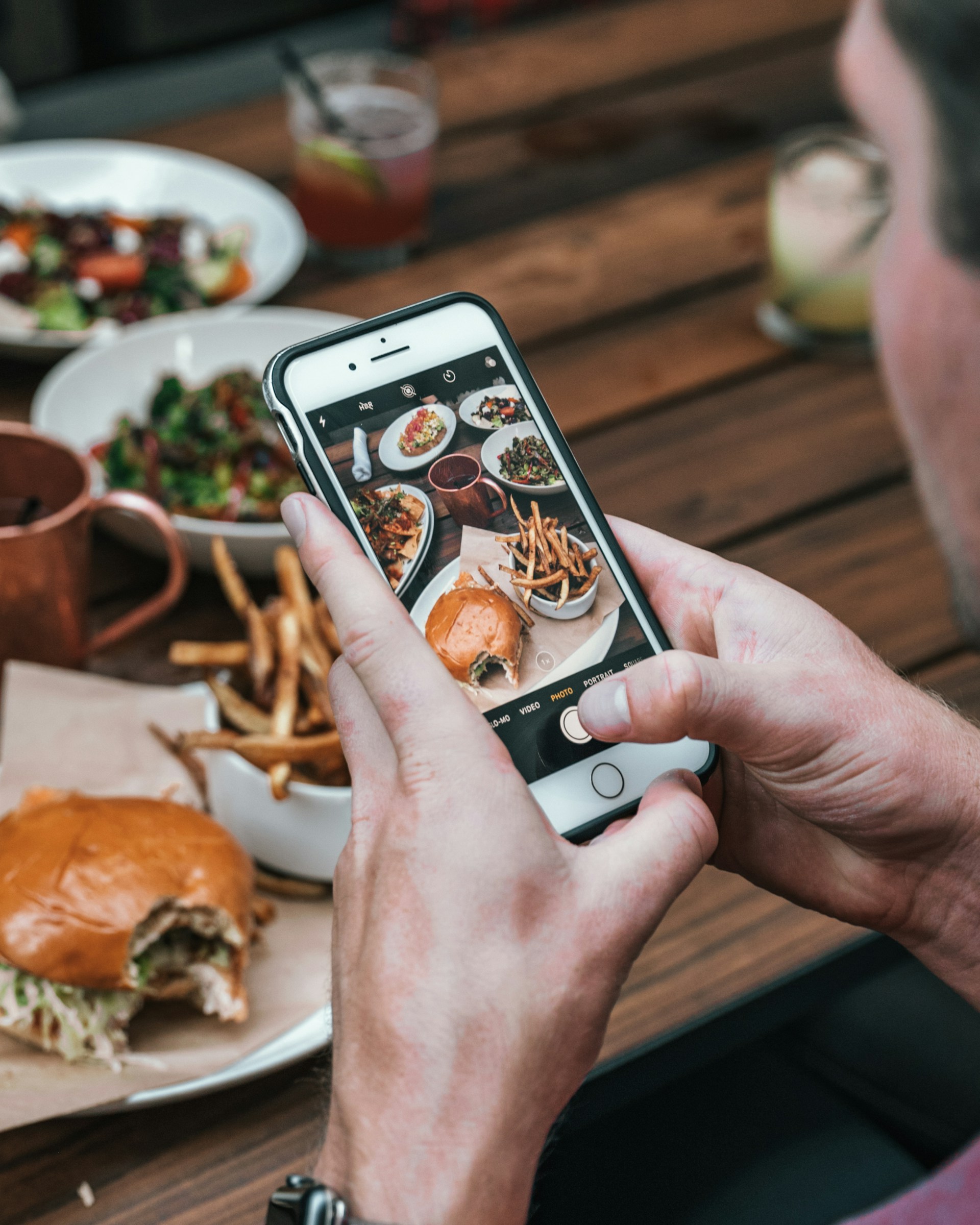 Chef taking photo of dish